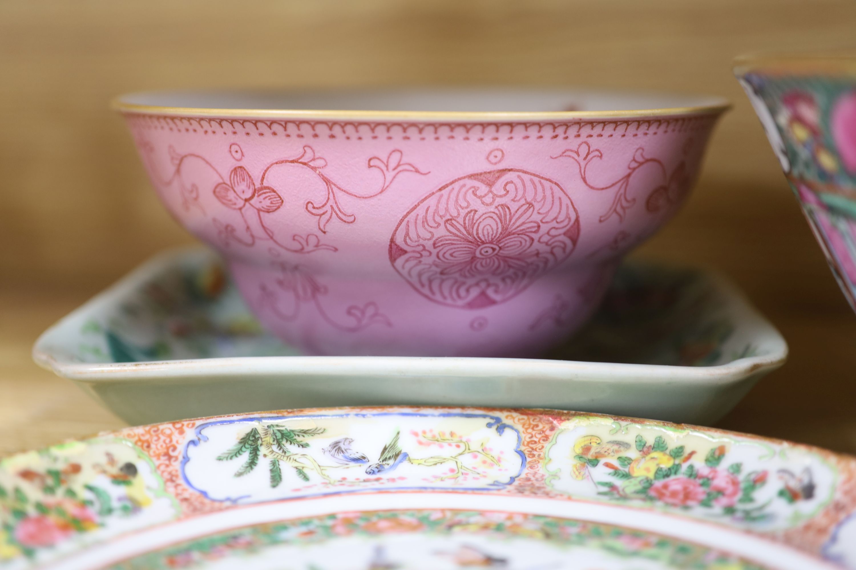 A Chinese pink ground bowl, late 19th century together with two other bowls, a famille verte dish and a plate